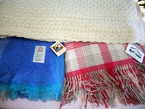 Blue and pink throws from Avoca, Aran knit from House of Ireland